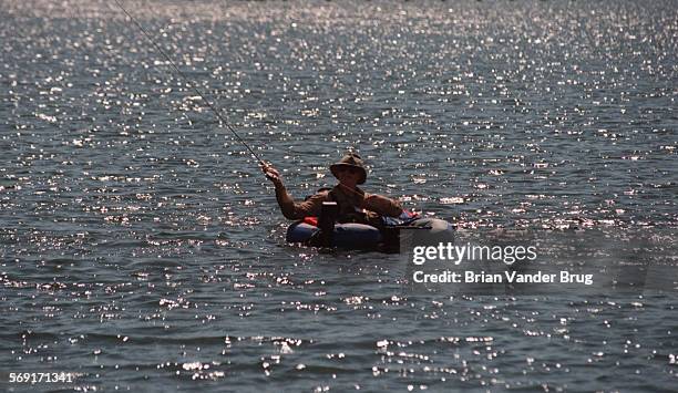 Freshwater.1.bv.514/CASTAIC  A flyfisherman Roy Wunderlich of Santa Monica casts in the waters of lower Castaic Lake Wednesday May 7 1997....