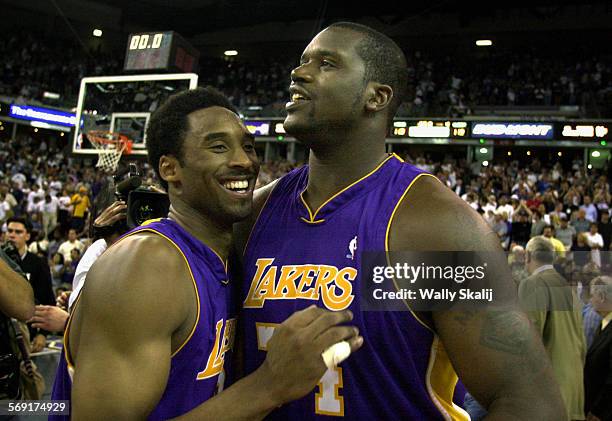 Lakers9.WS Lakers Kobe Bryant, left, celebrates his 48points with Shaquille O'Neal after defeating the Kings in Game 4 of the Western Conference...