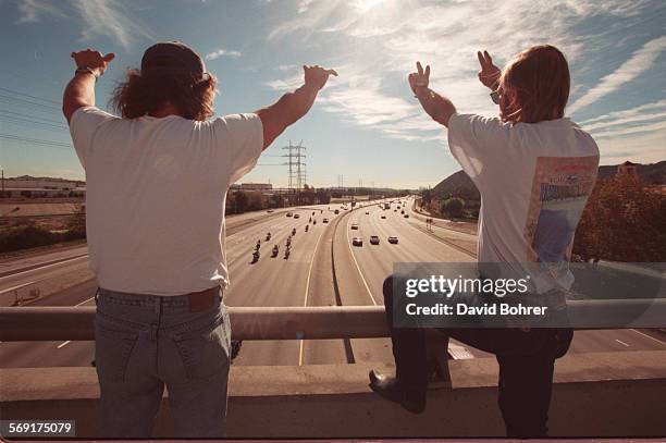 Bikers.#4.db.1110; . Haley Davidson enthusiasts wave and signal to the thousands of bikers that crossed below this Glendale overpass during the 13th...