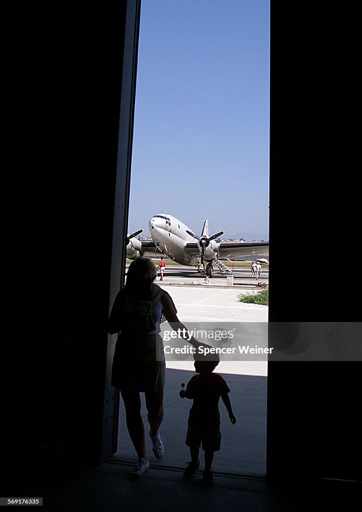 Jennifer Eearden of Camarillo and her son, Bryce,2, explore the Southern California Wing of the Conf