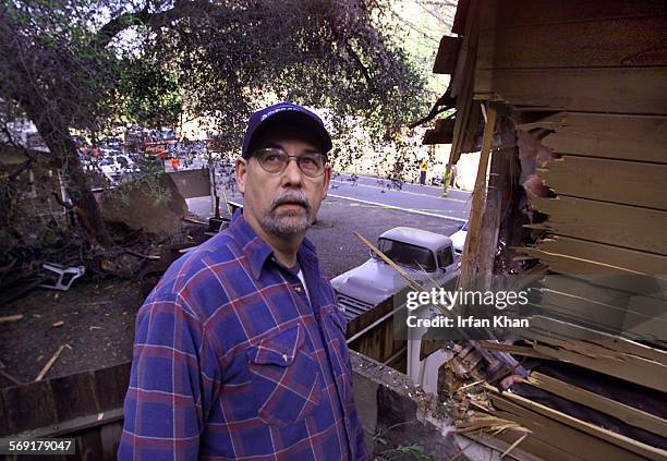 Richard Valentine by his house which was badly damaged when a boulder slide hit three structures along Silverado Canyon on Saturday morning. His wife...