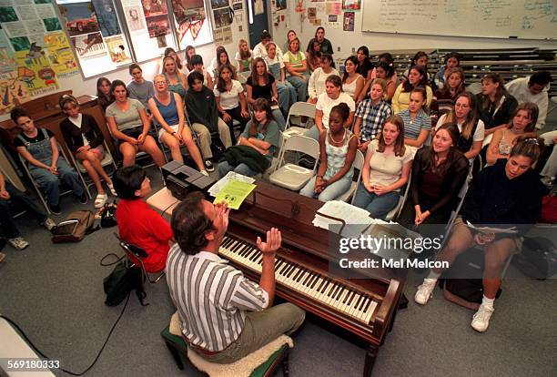 Instructor Raymond Hebel teaches advanced chorus to students at Moorpark H.S.