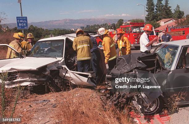 Crash.3.0909.JLWith victims still in both cars paramedics tend to them after both cars hit head on on Topanga Canyon Blvd just south of Mulholland...
