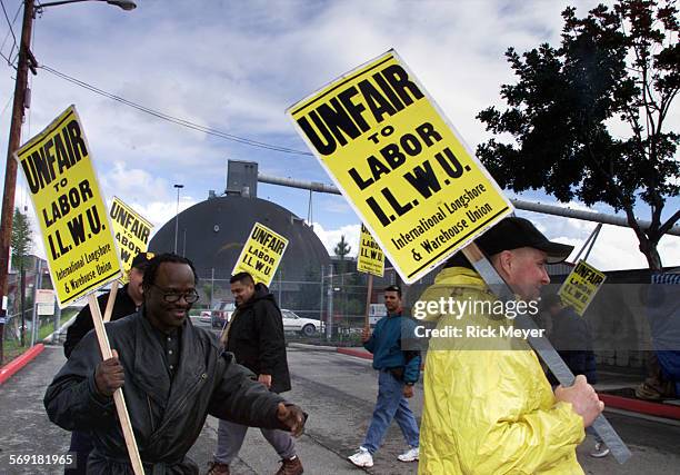 Strike1.rm Members of International Longshore and Warehouse Union members hold a unfair labor practices strike against Savage Pacific Services in the...