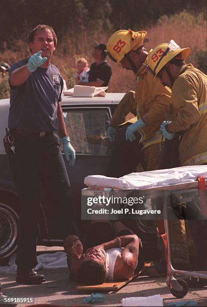 Crash.4.0909.JLAfter removing one of the victims from the car that was believed to be going the wrong way on Topanga Canyon Blvd paramedics get ready...