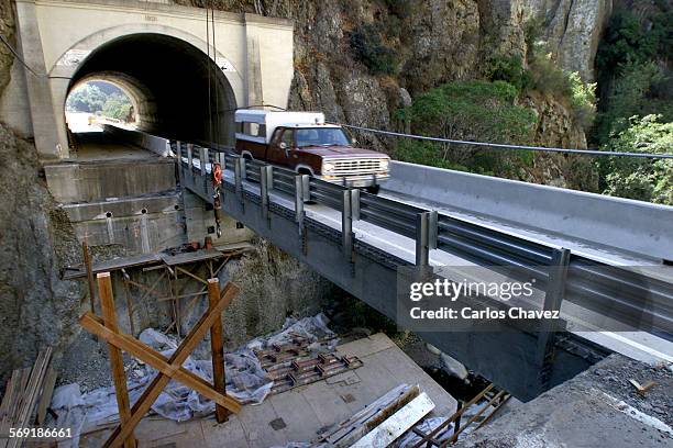 Bridge between the tunnels on Route 33 above Ojai is being retofitted to meet earthquake standards. Traffic is monitored by traffic lights at each...