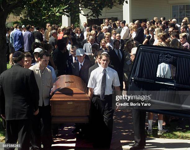 Pall bearers bring casket of Nicholas Samuel Markowitz out of chapel at Groman Eden Mortuary in Mission Hills.