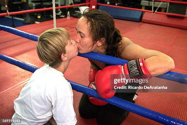 Tuesday, 10/3/2000, Simi Valley, CA  DIGITAL IMAGE  Boxer Alicia Doyle greeting Thomas Bowers who her little friend who was waiting for his boxing...