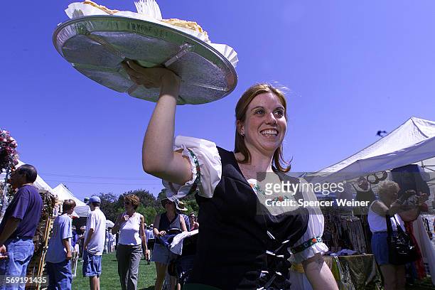 Lindsey Brunson works the crowd selling strudel at 14th annual Oktober Festival Sunday at Conejo Creek Park. The Newbury Park Rotary Club hosts the...
