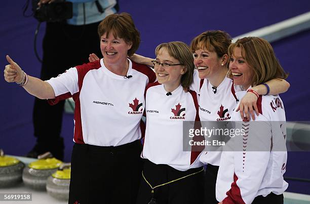 Glenys Bakker, Amy Nixon, Christine Keshen and Shannon Kleibrink of Canada celebrate after defeating Norway in the bronze medal match of the women's...