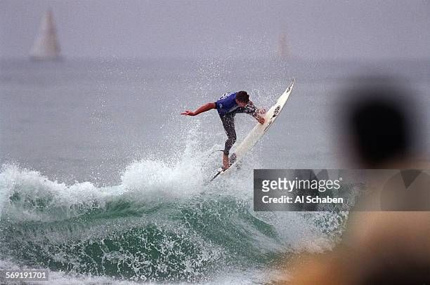Andy Irons, of Hawaii, gets some air off of Saturday's bigger waves much to the fans' approval during his win over Jake Patterson, of Australia in...