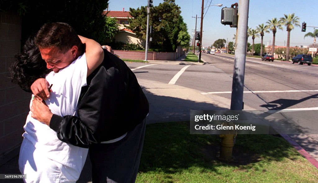 Evan Prather (Right) gives Jackie Green a hug at the scene were 40 yearold Balvina Delgado was kill