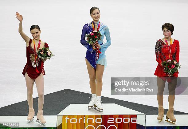 Sasha Cohen of the United States, silver medal Shizuka Arakawa of Japan, gold medal and Irina Slutskaya of Russia , bronze medal pose on the podium...