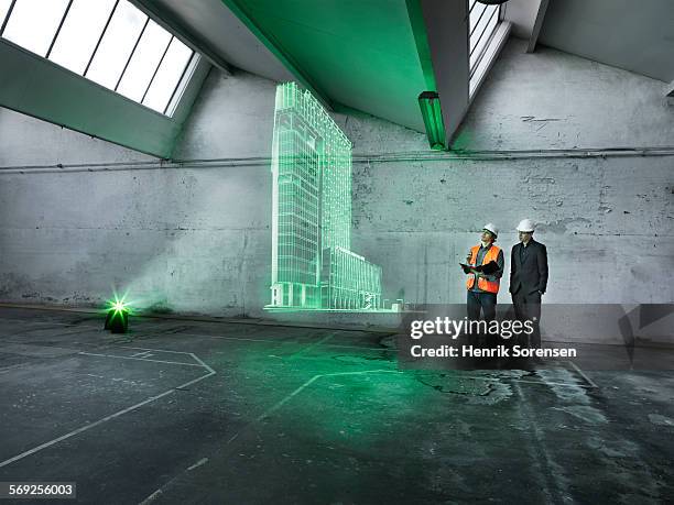 hologram in warehouse - hologram projection stock pictures, royalty-free photos & images