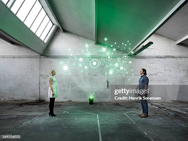 hologram in warehouse - hologram projection stock pictures, royalty-free photos & images