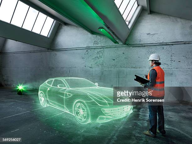 hologram in warehouse - car engineer stock-fotos und bilder