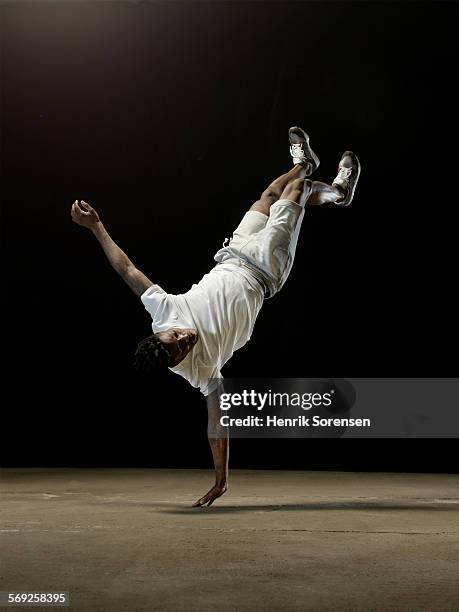male athlete one handed handstand - handstand stock pictures, royalty-free photos & images