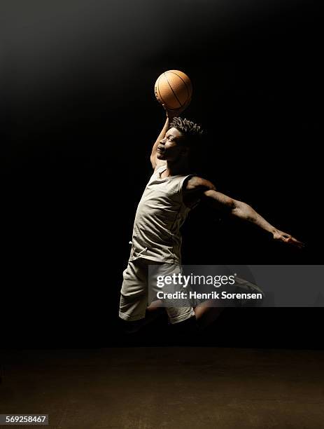 basketball player jumping with ball - basketball player ストックフォトと画像