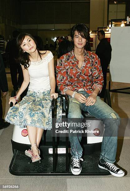 Actors Annie Liu and Dylan Kuo Pin Chao get a buggy ride to a press conference during the Bangkok International Film Festival at Siam Paragon...