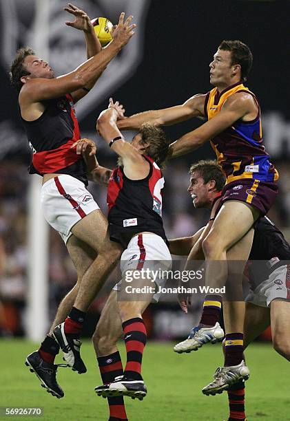 Kepler Bradley of Essendon contests the ball with Mitchell Clark of the Lions during the first round NAB Cup match between the Brisbane Lions and...