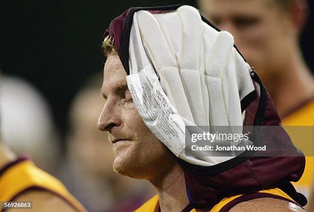 Michael Voss of the Lions cools off during quarter time during the first round NAB Cup match between the Brisbane Lions and Essendon at Carrara...