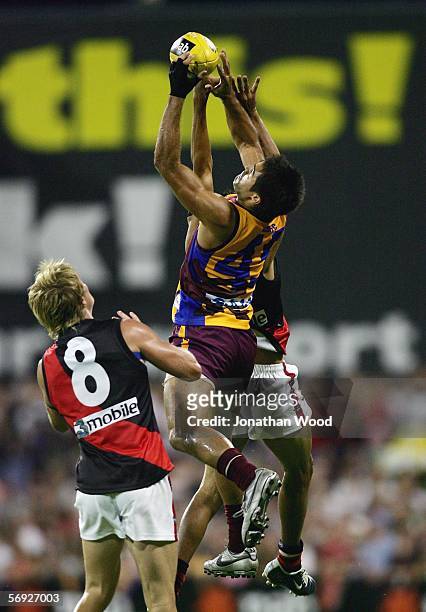 Scott Harding of the Lions takes a mark during the first round NAB Cup match between the Brisbane Lions and Essendon at Carrara Stadium on February...