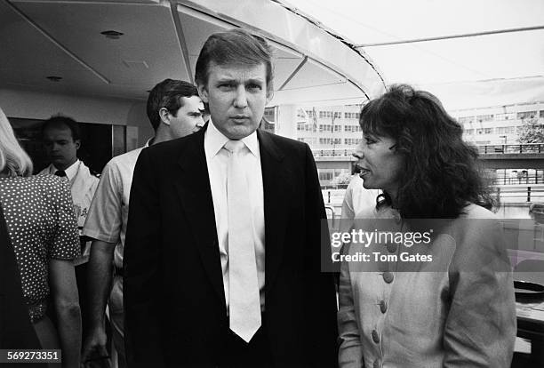 American real estate magnate Donald Trump with ballet dancer Janet Villella at a press preview of his newly refurbished 85-metre motor yacht, Trump...