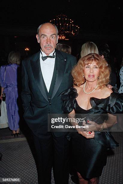 Scottish actor Sean Connery with his wife Micheline Roquebrune attend the 1990 BAFTA Film and Television Awards in March 1990 in London, England.