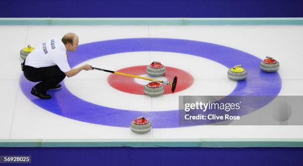 Ewan MacDonald of Great Britain lines up a shot during the Gold medal match of the men's curling between United States and Great Britain during Day...