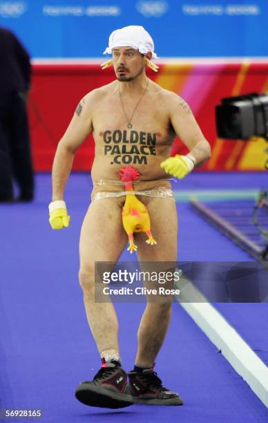 Streaker makes his way into the arena during the Gold medal match of the men's curling between United States and Great Britain during Day 14 of the...