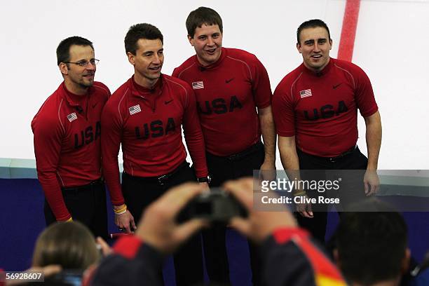 Shawn Rojeski, Pete Fenson, John Shuster and Joe Polo of United States celebrate after defeating Great Britain in the bronze medal match of the men's...