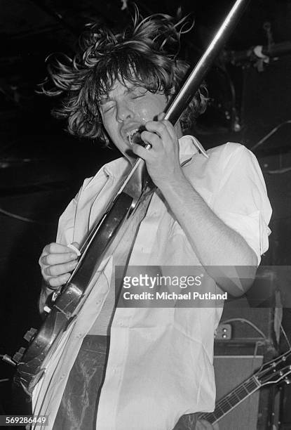 Guitarist Angus Young performing with hard rock group AC/DC at the Marquee Club, London, 12th May 1976.