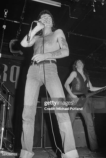 Singer Bon Scott and bassist Mark Evans performing with hard rock group AC/DC at the Marquee Club, London, 12th May 1976.