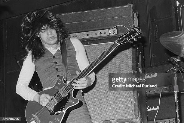 Rhythm guitarist Malcolm Young performing with hard rock group AC/DC at the Marquee Club, London, 12th May 1976.