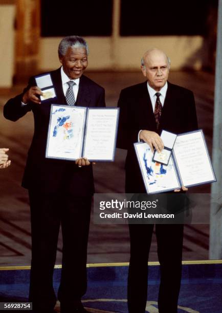 Nelson Mandela and F.W. De Klerk, the South African President, receive the Nobel Peace Prize at City Hall in Oslo, Norway on December 10, 1993.