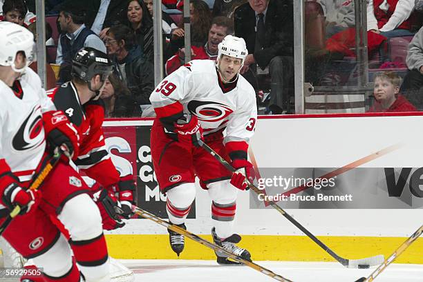 Doug Weight of the Carolina Hurricanes handles the puck against the New Jersey Devils on February 3, 2006 at the Continental Airlines Arena in East...