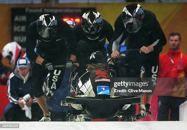 Pilot Todd Hays, Pavle Jovanovic, Steve Mesler and Brock Kreitzburg of the United States 1 compete in the Four Man Bobsleigh event on Day 14 of the...