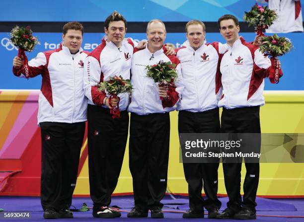 Brad Gushue, Mark Nichols, Russ Howard, Jamie Korab and Mike Adam of Canada celebrate winning gold after the Gold medal match of the men's curling...