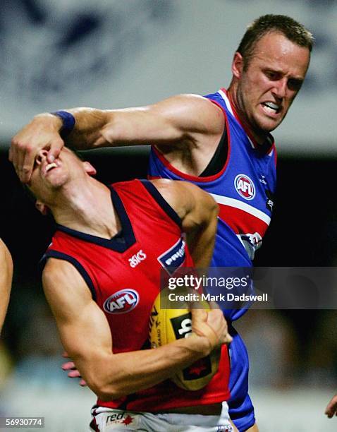 Chris Grant for the Bulldogs gives a free kick away to Nathan Brown for the Demons during the NAB Cup round one match between the Western Bulldogs...