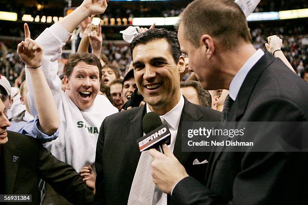 Head coach Jay Wright of the Villanova Wildcats is interviewed for ESPN by color commentator Jay Bilas after defeaing the Connecticut Huskies on...