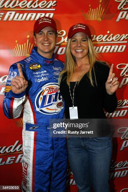 Kurt Busch, driver of the Miller Lite Dodge, poses with fiancee Eva Bryan after winning the pole for the NASCAR Nextel Cup Series Auto Club 500 on...