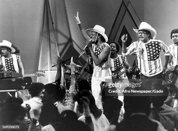 American rhythm and blues and funk group the Gap Band performing on stage, 1979. The group included family members and brothers Charlie, Ronnie, and...