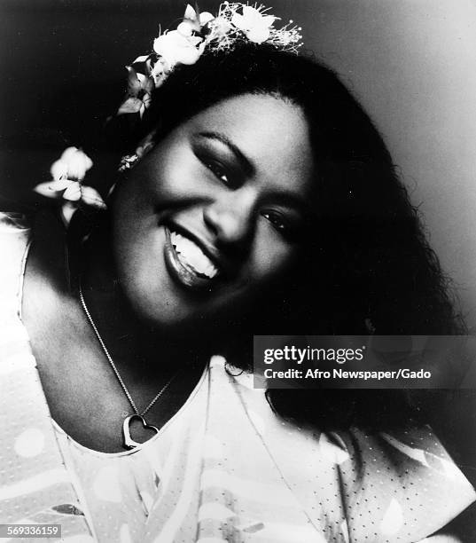 American soul singer and performing artist Jennifer Holliday with flowers in her hair, 1990.