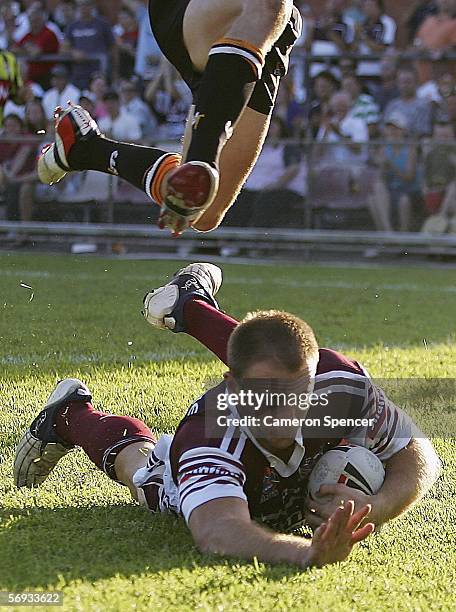 Paul Stephenson of the Sea Eagles scores a try during the NRL pre-season trial match between the Manly Warringah Sea Eagles and the Wests Tigers at...