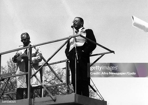 As department of transportation commissioner Herman Williams Jr looks on, Mayor Kurt Schmoke commending all who played a part in the reconstruction...