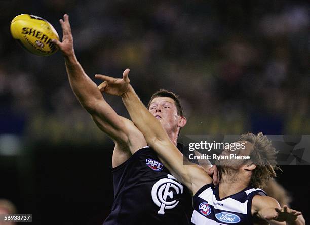 Barnaby French for the Blues competes in the ruck against Joel Corey#11 for the Cats during the round one NAB Cup match between the Carlton Blues and...