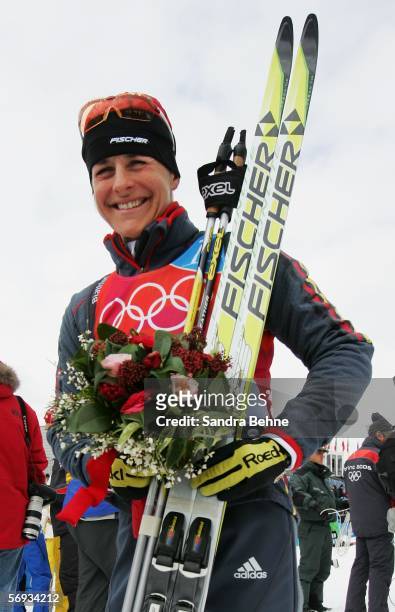 Uschi Disl of Germany celebrates winning the bronze medal in the Womens Biathlon 12.5km Mass Start Final on Day 15 of the 2006 Turin Winter Olympic...