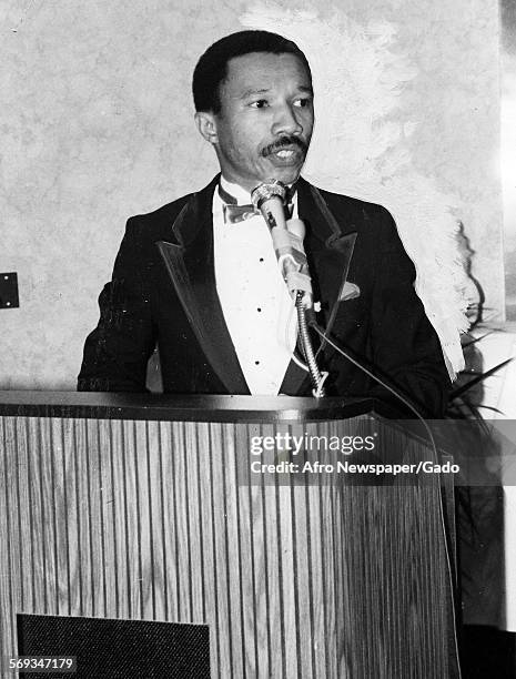 Kweisi Mfume speaking at a podium, 1987.