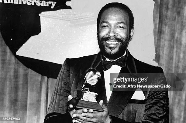 Marvin Gaye holding a Grammy award, 1982.