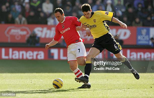 Radostin Kishishev of Charlton Athletic battles with Gareth Barry of Aston Villa during the Barclays Premiership match between Charlton Athletic and...